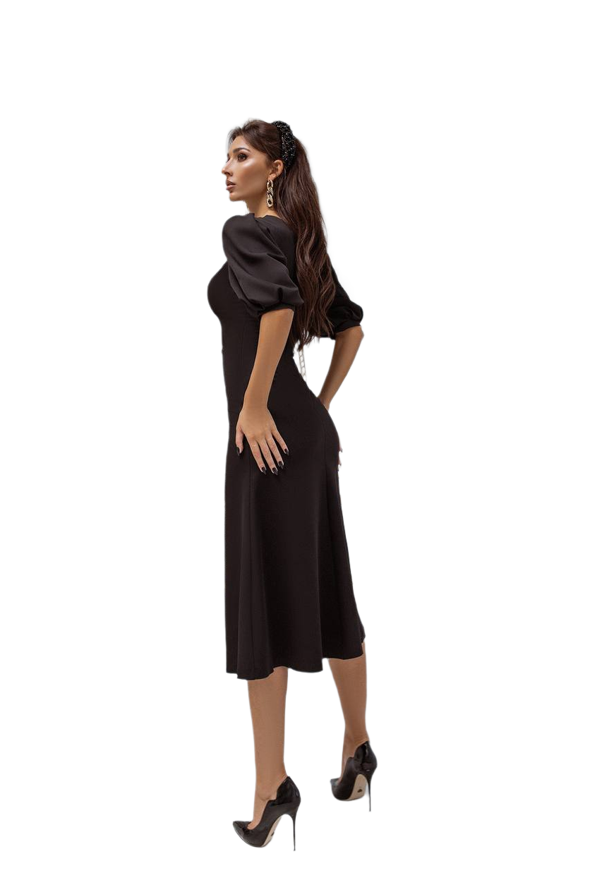 Woman wearing a black dress with puff sleeves on a white background