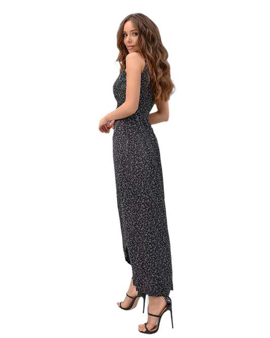 Woman wearing a black and white patterned dress on a white background