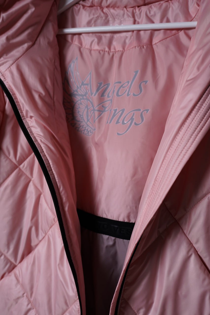 Pink jacket with 'Angels Wings' embroidery on a hanger