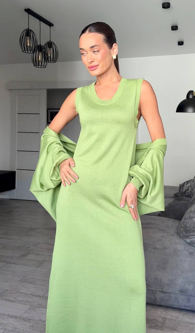 Woman wearing a light green dress in an indoor setting