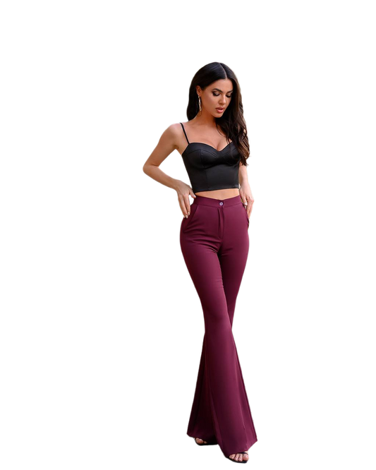 Woman wearing a black top and burgundy flared pants on a white background