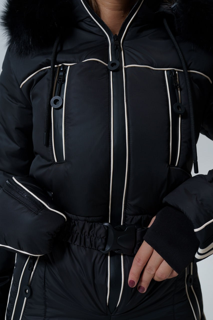 Black snowsuit with white accents on a plain background