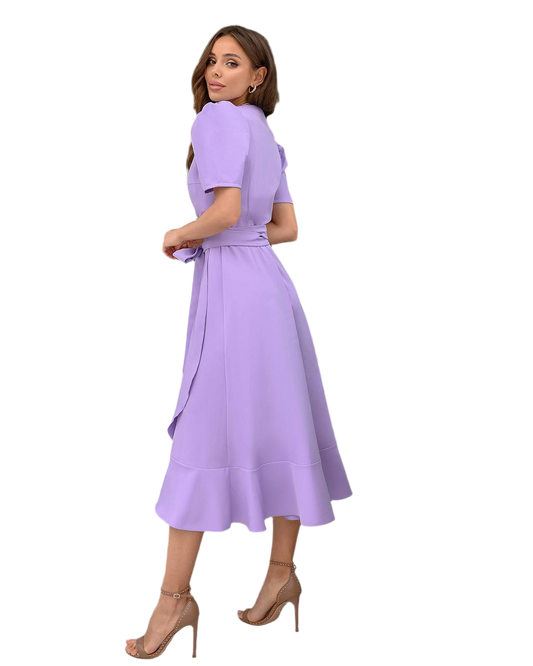 Woman wearing a purple dress on a white background