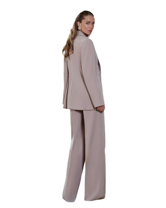Woman wearing a beige suit on a white background