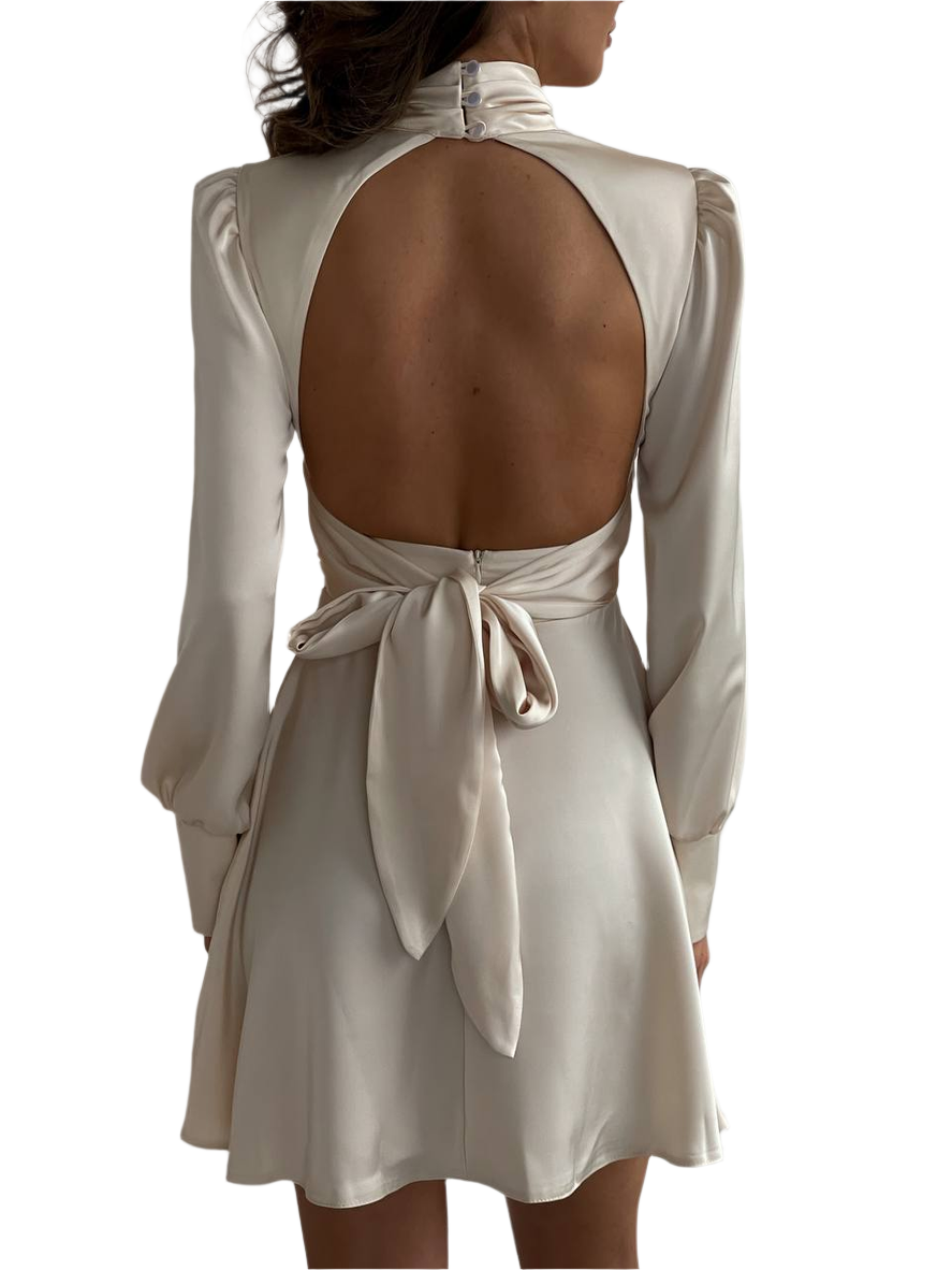 Beige dress with open back and long sleeves on a white background