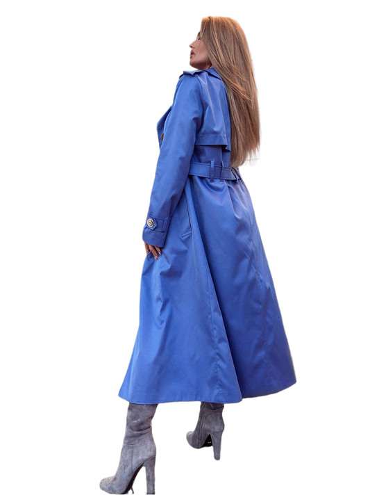 Woman wearing a blue trench coat on a white background