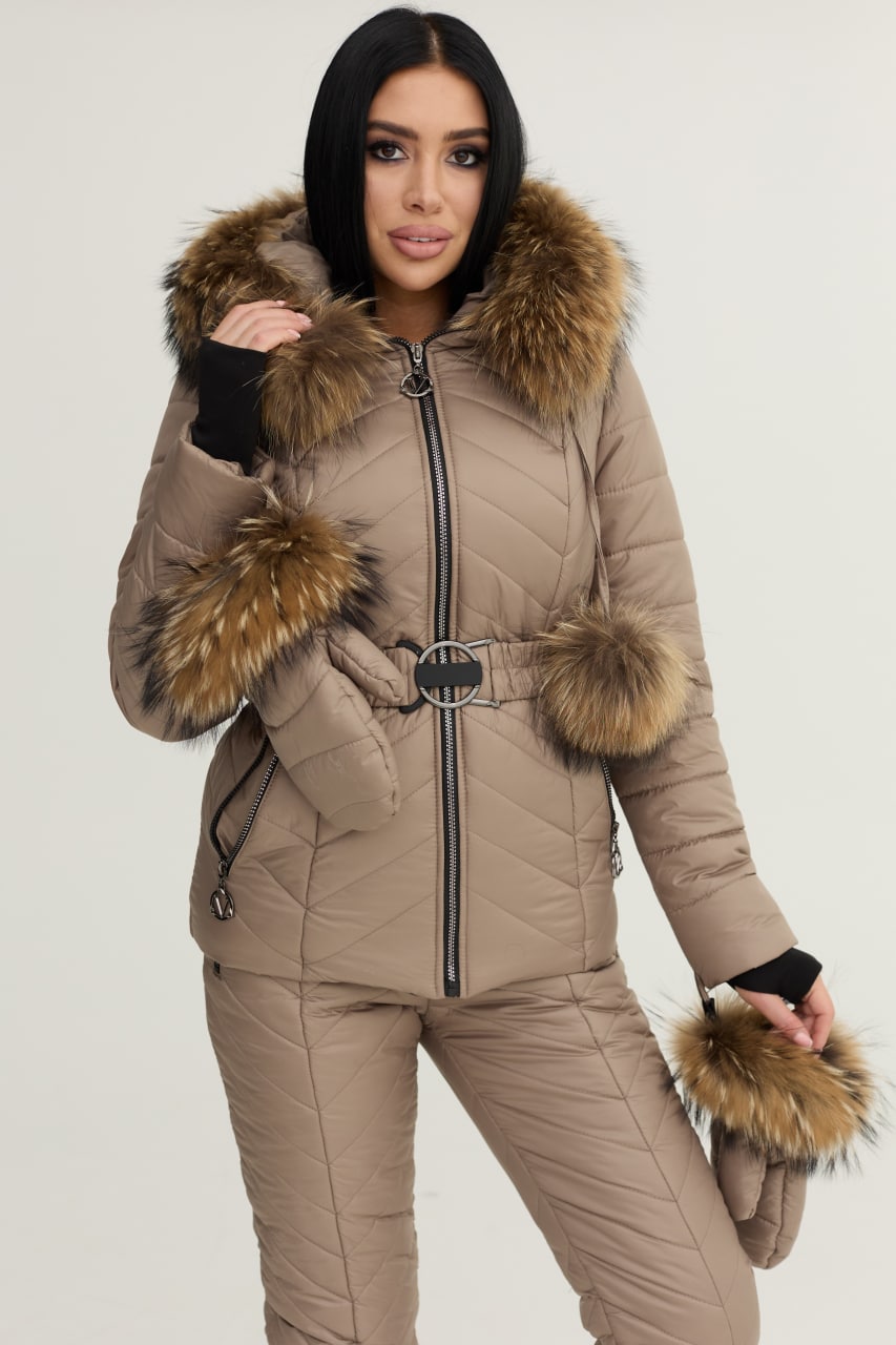 Woman wearing a beige winter coat with fur trim on a white background