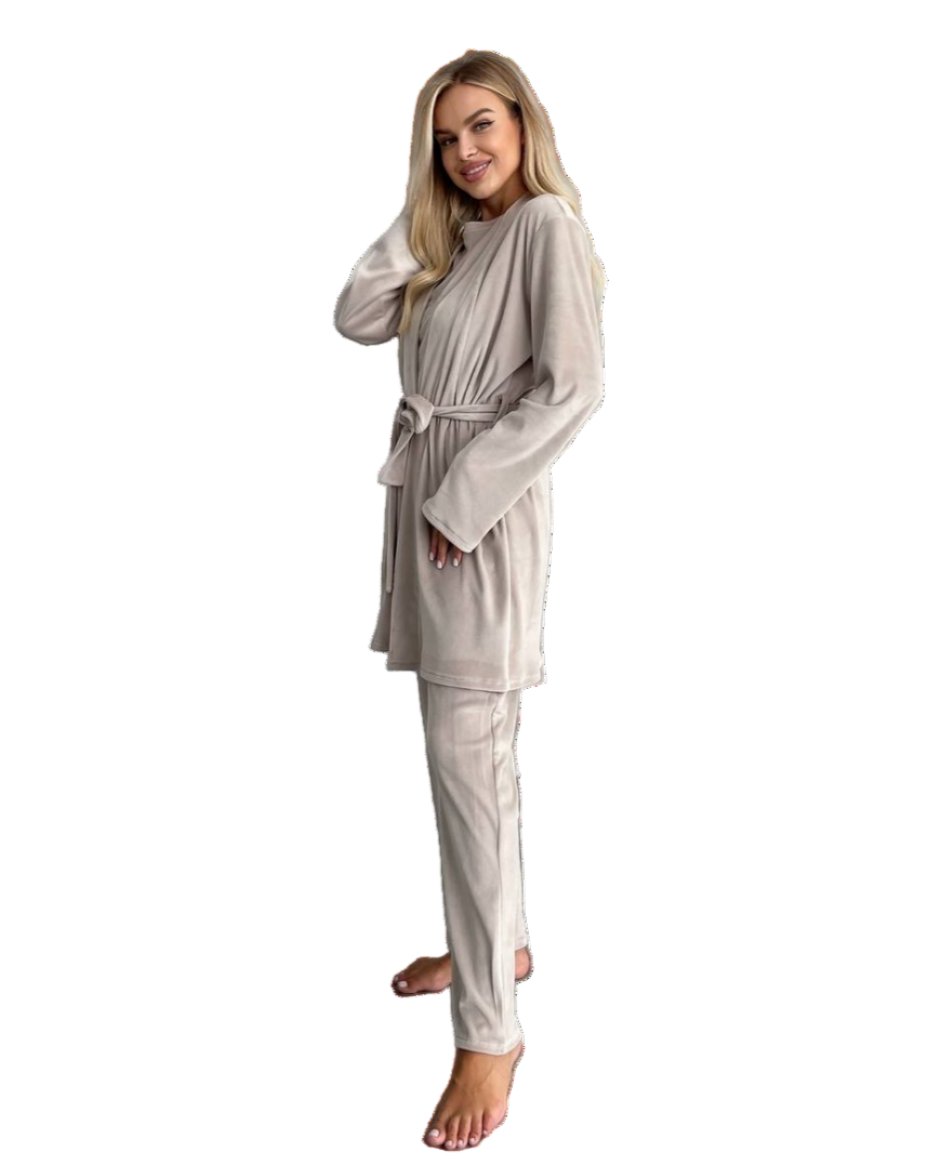 Woman wearing a beige robe and pajama set on a white background