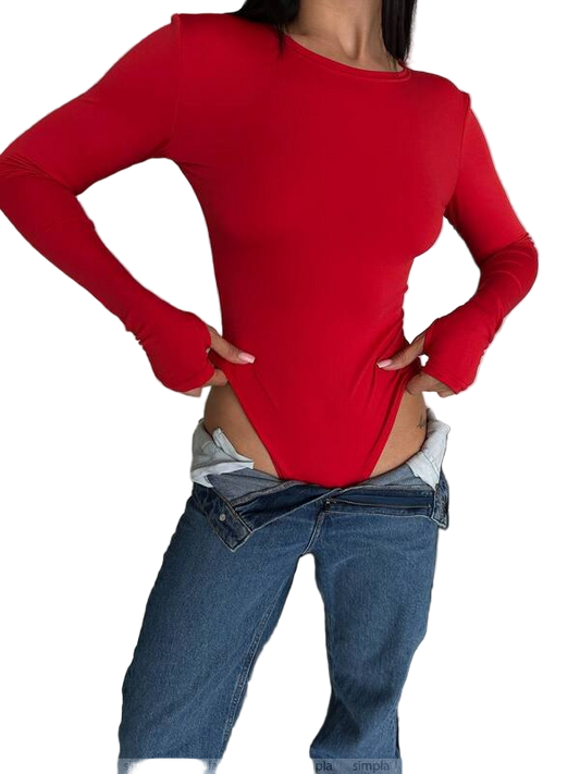 Person wearing a red long-sleeve top and blue jeans on a white background
