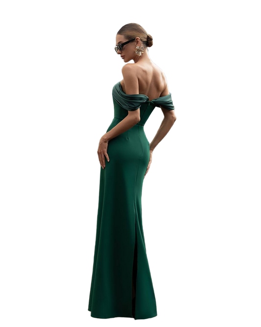 Woman wearing a green off-shoulder evening gown on a white background