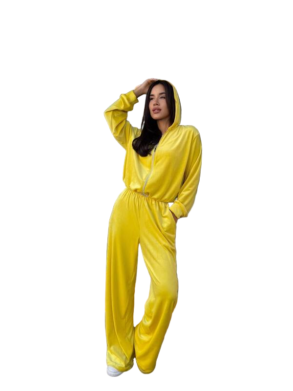 Woman wearing a yellow onesie against a white background