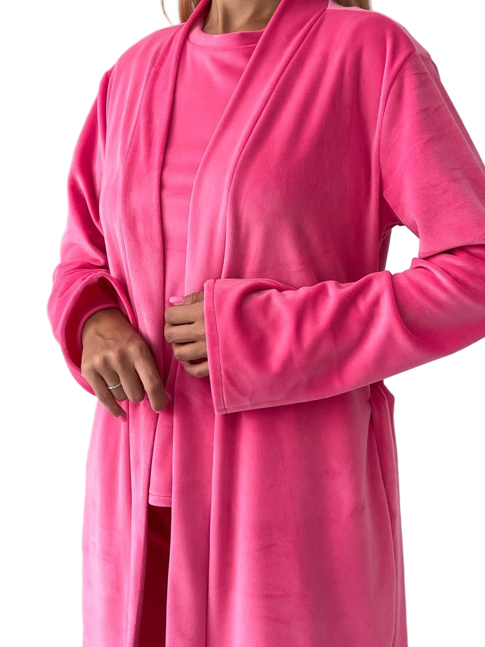 Person wearing a pink robe on a white background