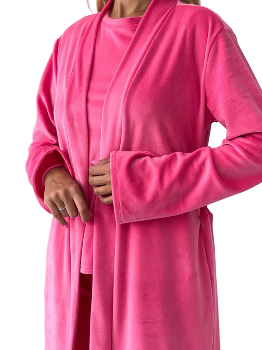 Person wearing a pink robe on a white background