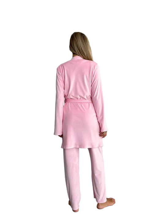 Person wearing a pink pajama set on a white background