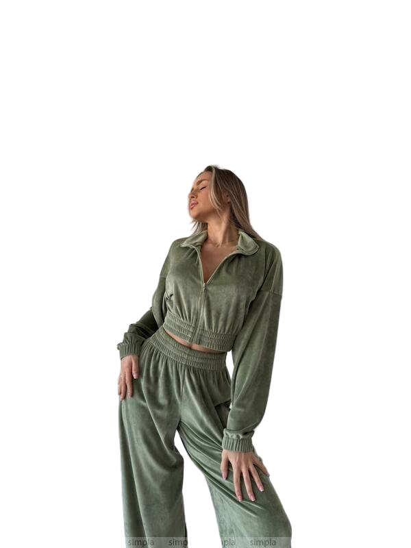 Woman wearing a green tracksuit on a white background