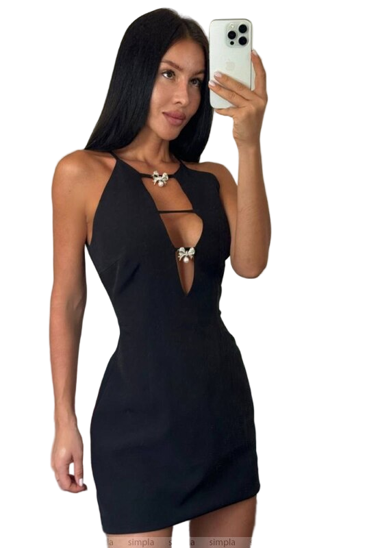 Woman taking a selfie wearing a black halter neck dress on a white background