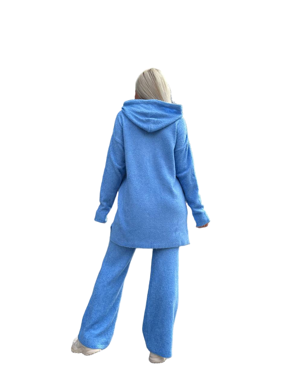 Person wearing a blue tracksuit on a white background