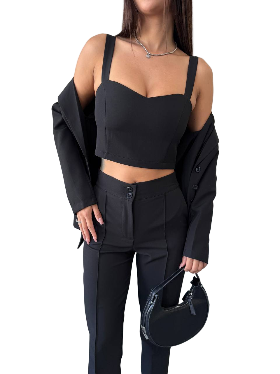Person wearing a black outfit with a jacket and helmet on a white background