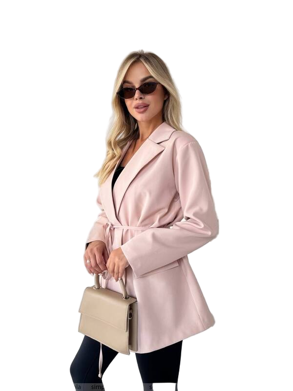 Woman wearing a pink coat and sunglasses, holding a beige handbag on a white background