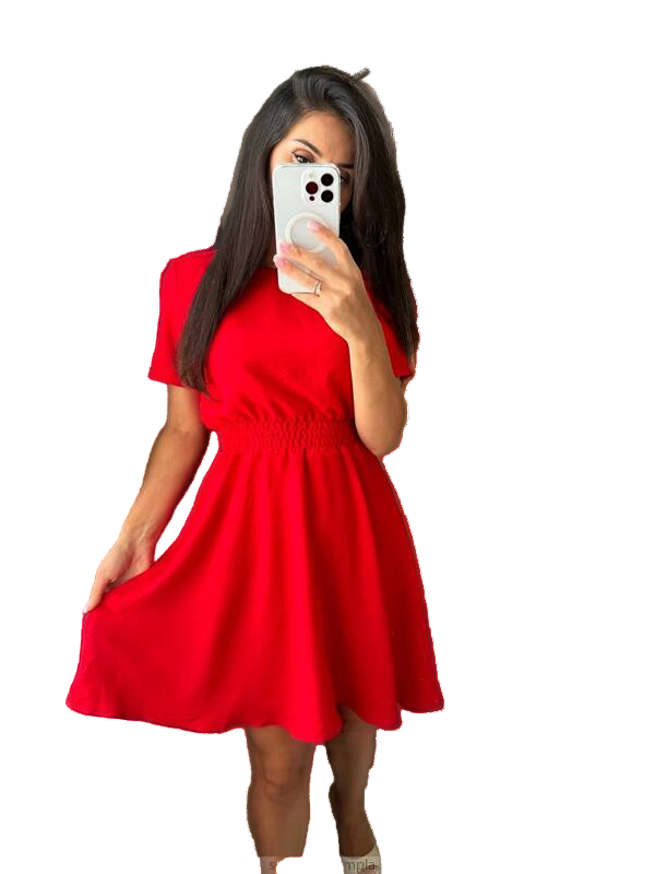 Woman wearing a red dress taking a mirror selfie on a white background
