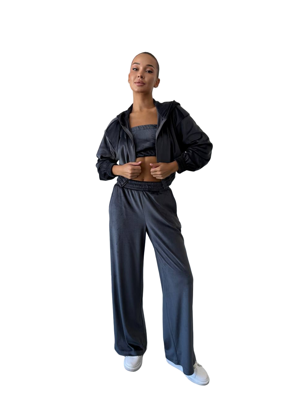 Person wearing a black tracksuit on a white background