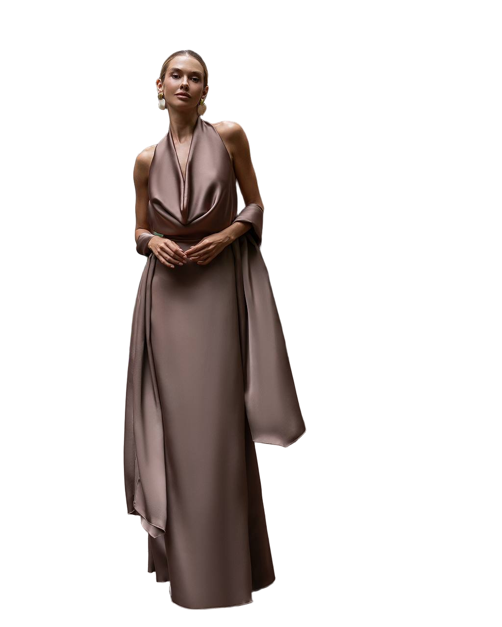Woman wearing a long, flowing brown dress on a white background