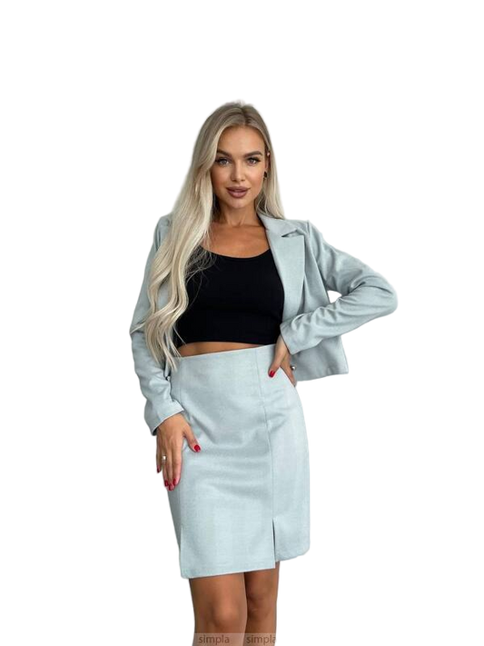 Woman wearing a light blue jacket and skirt set on a white background