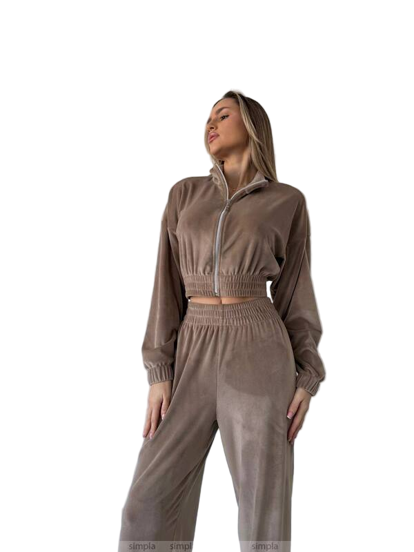 Woman wearing a brown tracksuit on a white background