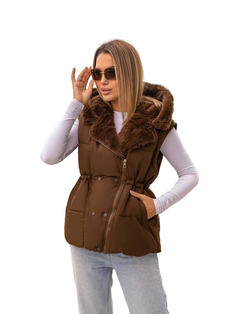 Woman wearing a brown puffer vest with fur trim on a white background