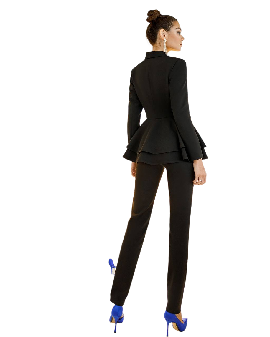 Woman wearing a black suit with blue high heels on a white background