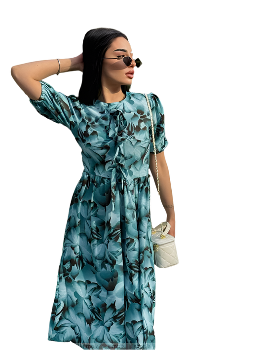 Woman wearing a blue floral dress on a white background