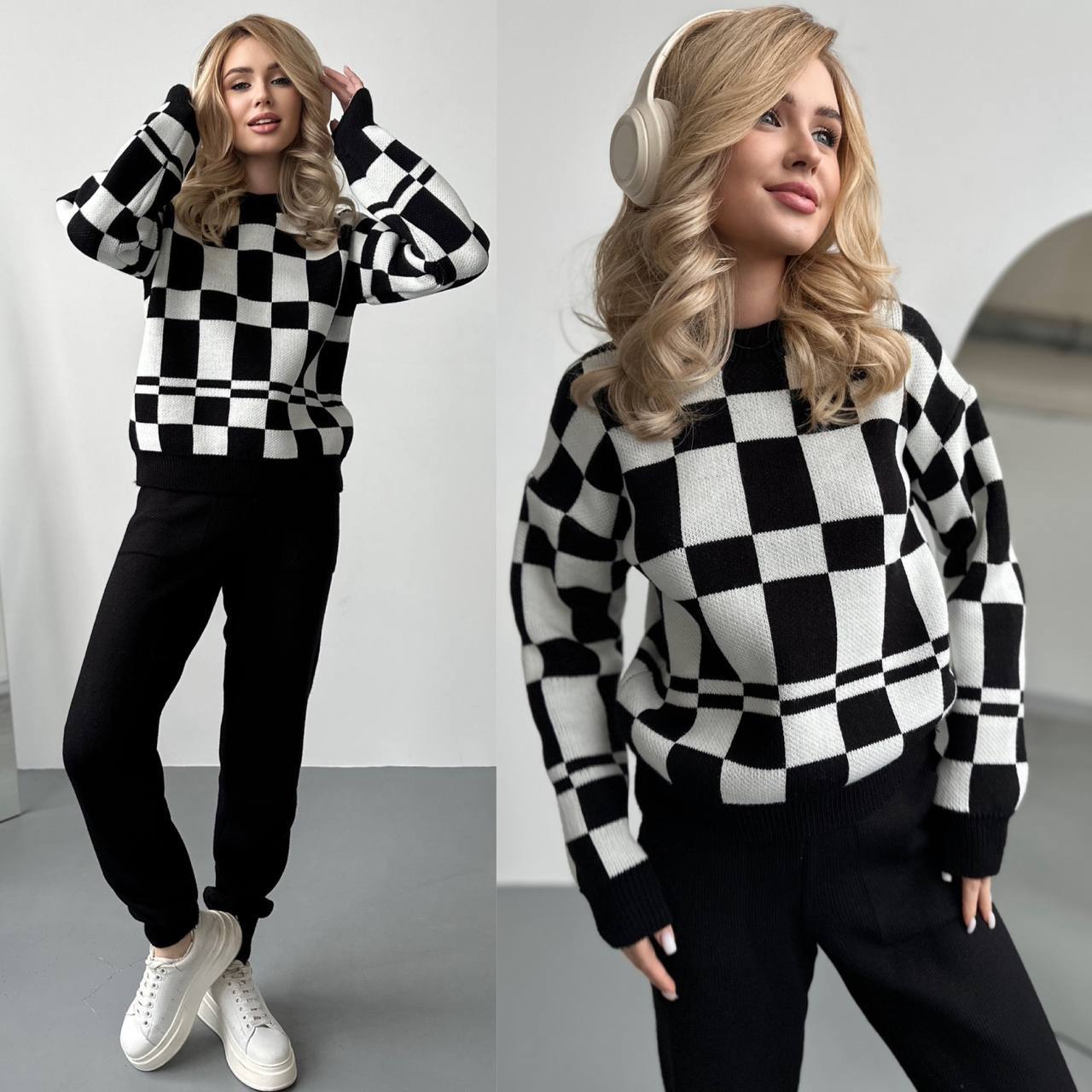 Woman wearing a black and white checkered sweater and pants with headphones on a plain background