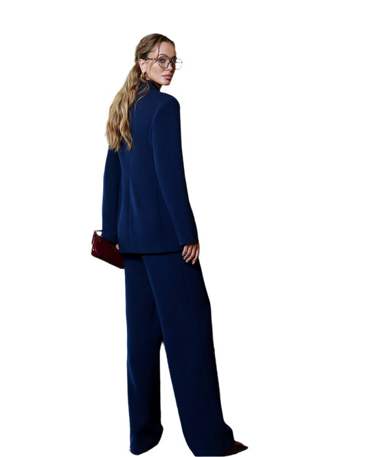 Woman wearing a navy blue suit with a white background