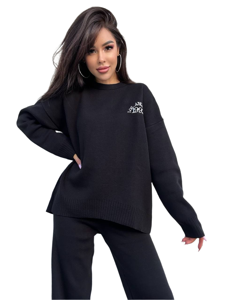 Woman wearing a black sweater with a logo on a white background