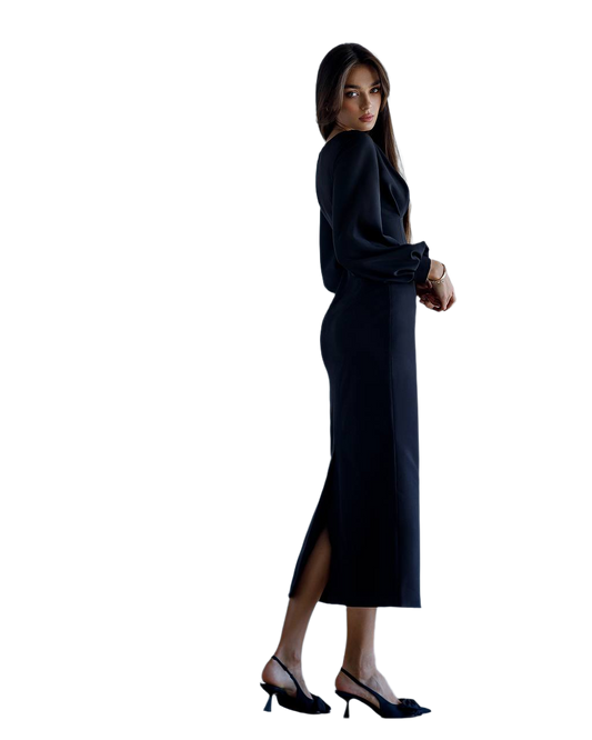 Woman wearing a black dress with a slit on a white background
