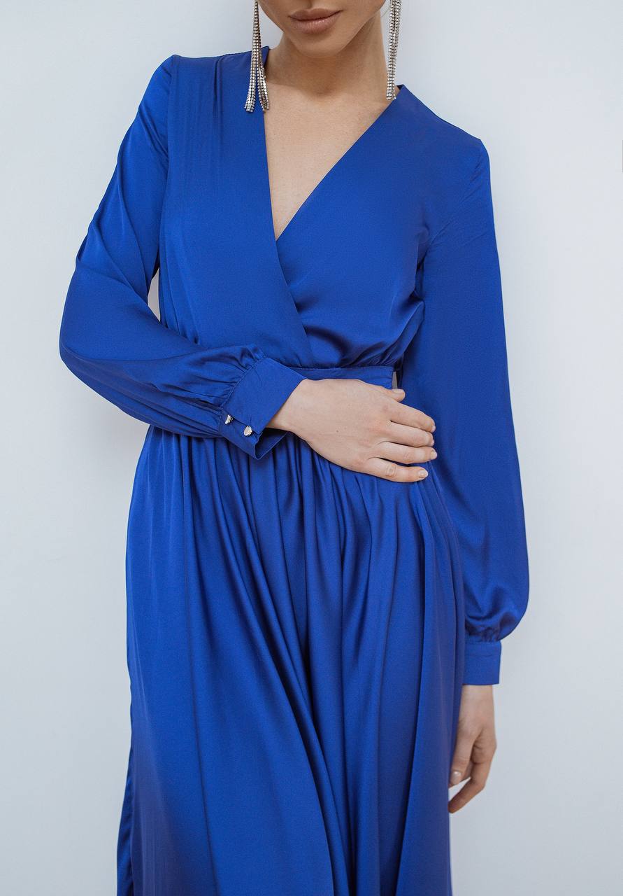 Blue dress worn by a person on a white background