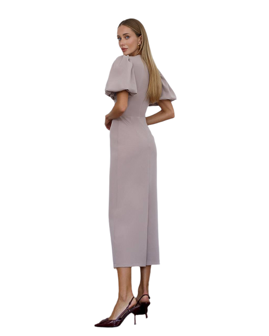 Woman wearing a light gray dress with short sleeves on a white background