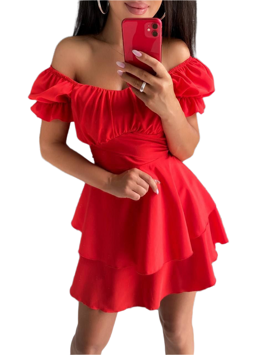 Red off-shoulder dress worn by a person on a white background