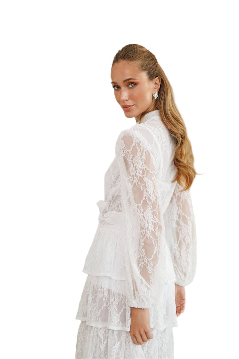 Woman wearing a white lace outfit on a white background