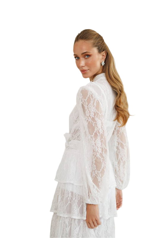 Woman wearing a white lace outfit on a white background