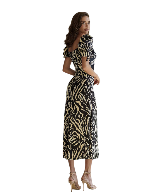Woman wearing a zebra print dress on a white background