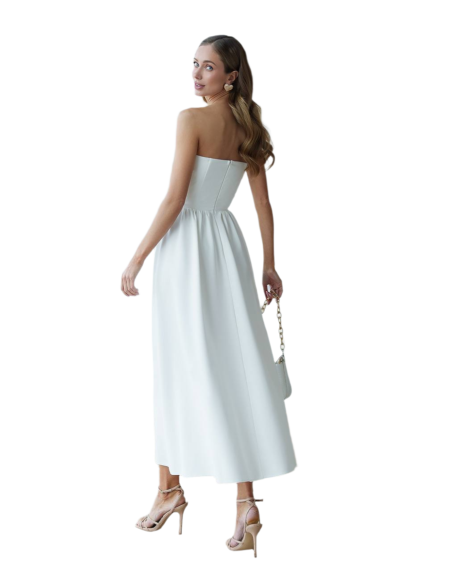 Woman wearing a strapless white dress on a white background