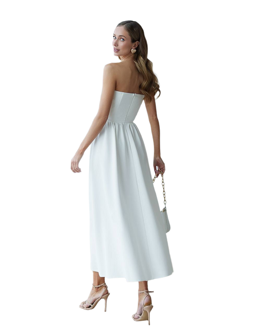 Woman wearing a strapless white dress on a white background