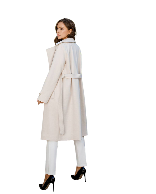 Woman wearing a long beige coat on a white background