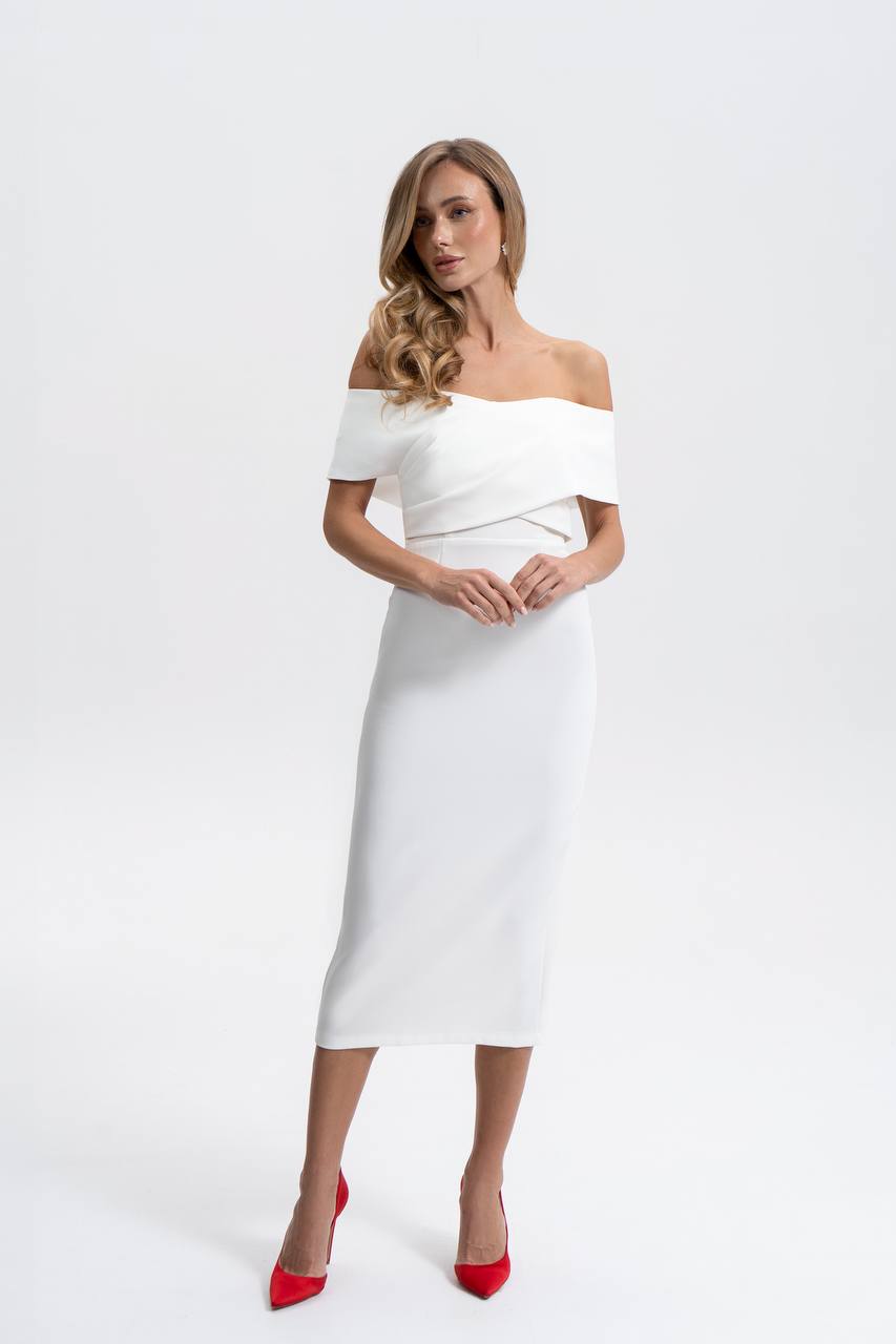 Woman wearing a white off-shoulder dress with a plain background