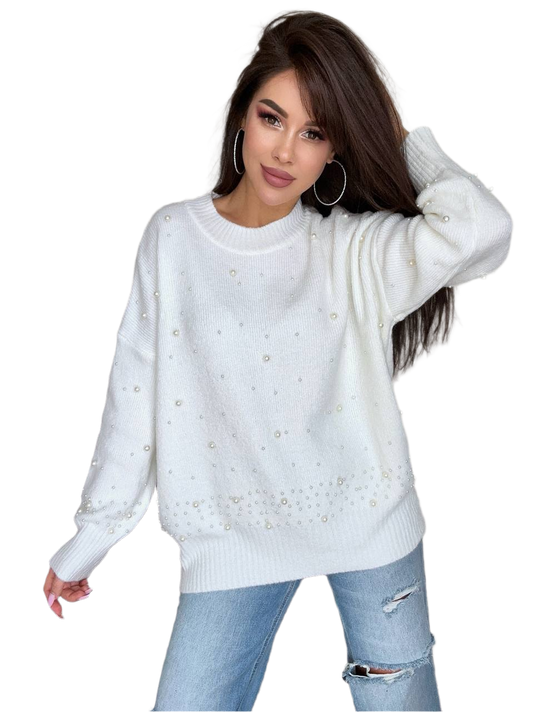 Woman wearing a white sweater with decorative elements on a white background