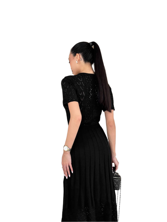 Woman wearing a black dress with a white background