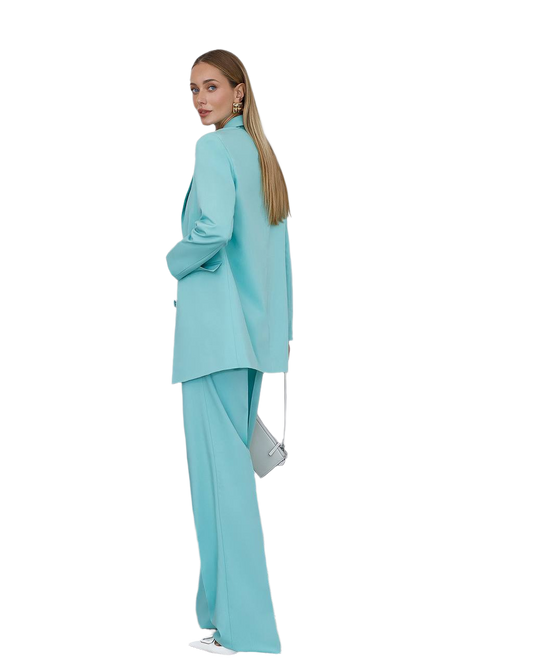Woman wearing a light blue suit on a white background