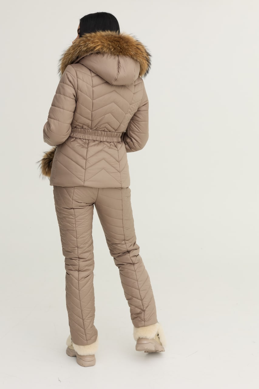 Beige quilted jacket and pants set with fur hood on a white background