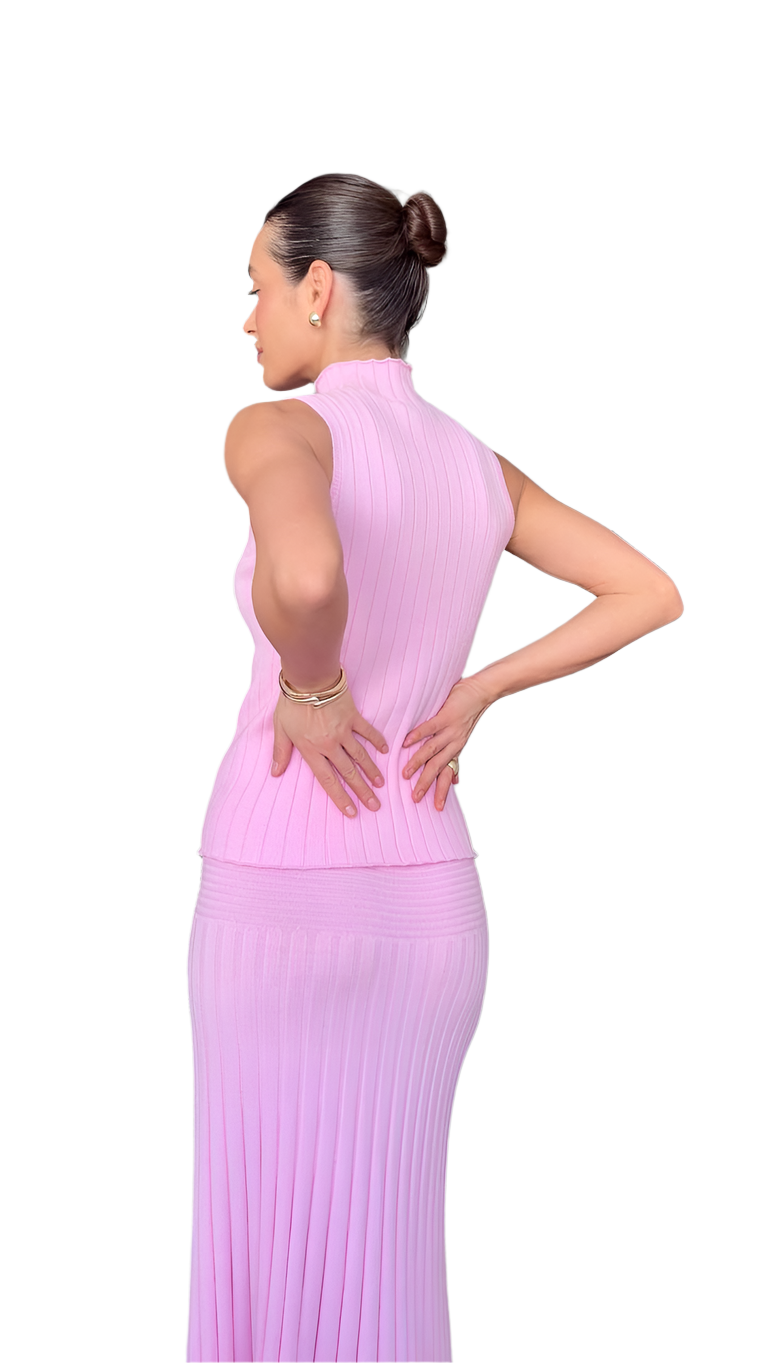 Woman wearing a pink dress on a white background